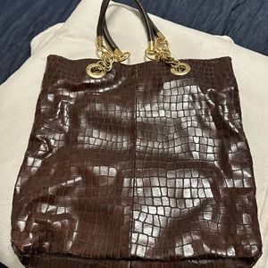 Gently used Cynthia Rowley purse with storage bag.